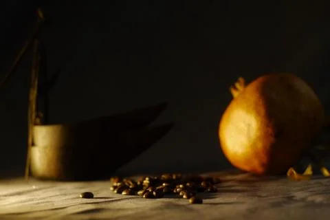 Artistic bodegon of coffee and grenades Stock Photos