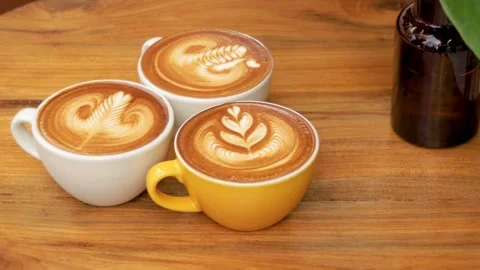 Artistic Coffee Brewing. Creating Beautiful Latte Art. Latte Techniques. 4K Stock Footage 244879032