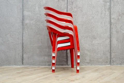 Artistic composition of red and white guest chair stack with bold patriotic Stock Photos