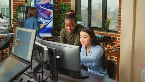 Artistic creators analyzing graphics industry software on computer Foto stock