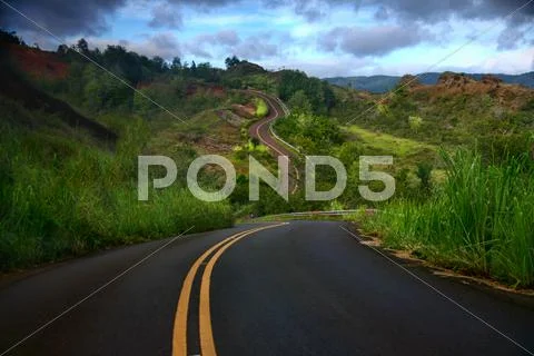 Artistic curved road on the island of kauai Stock Photos
