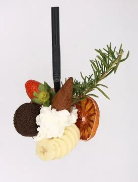 Artistic decorative straw featuring a creative arrangement of strawberries Stock Photos