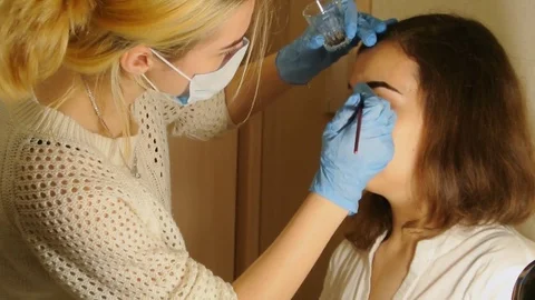 Artistic design of eyebrows. Eyebrow coloring with henna Stock Footage 83241089