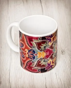 Artistic empty cup with handle for coffee or tea on the wooden background Stock Photos