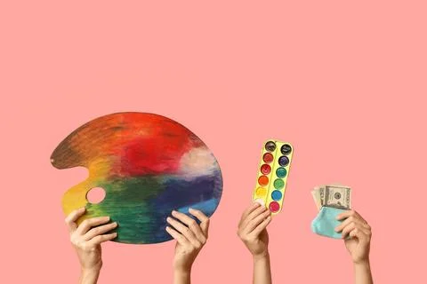 Artistic expression and financial value: hands holding paint palette, waterco Stock Photos