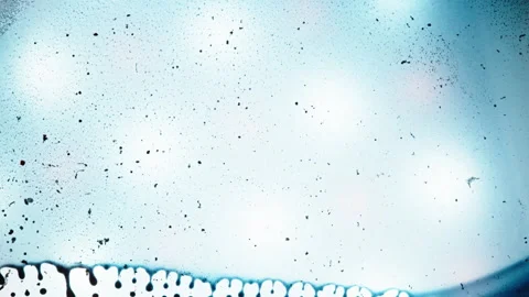 Artistic Flow of Blue Ink Creating Dreamy Patterns in Liquid Stock Footage 328345438