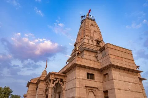 Artistic hindu temple with dramatic sunset sky at evening from unique persp.. Stock-Fotos