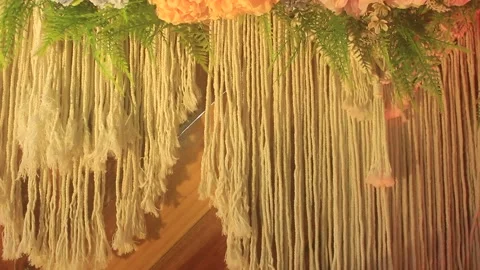 Artistic macrame art crafts made of knitting ropes and flower arrangements Stock Footage 170929552