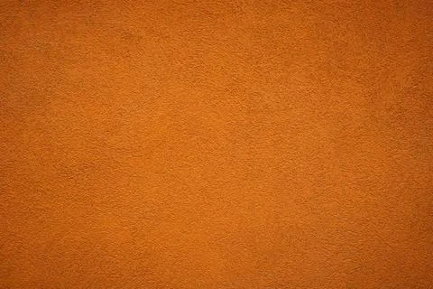 Artistic orange wall background with texture rough concrete stucco with vigne Stock Photos