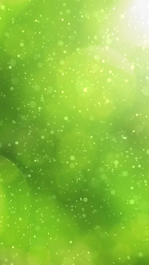 Artistic particles loop flying on vertical spring season green bokeh backgro Stock Footage 340588014
