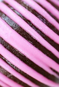 Artistic Pattern of Chocolate Cake Truffle Coated with Strawberry Icing Stock Photos