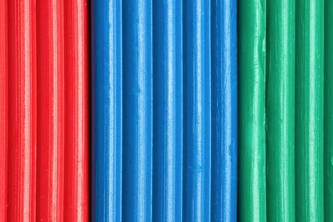 Artistic plastic clay for modeling in a box. Children red green blue RGB plas Stock Photos