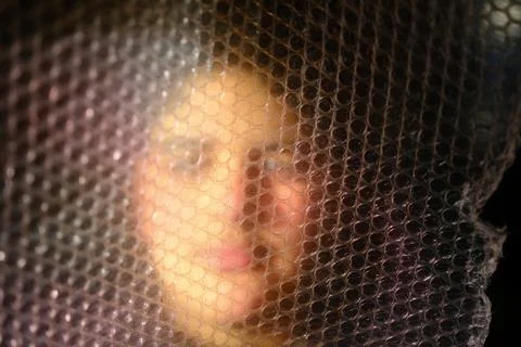 Artistic Portrait Behind Bubble Wrap Foto stock