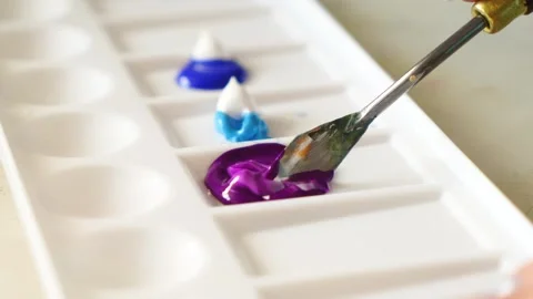 Artistic Process of Mixing blue and pink Pigments on a Palette. Stock Footage 248227627