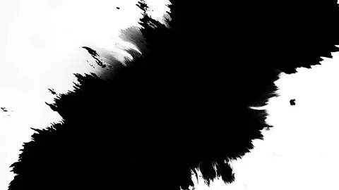 The Artistic Representation of an Abstract Black Ink Splash on a White Stock Footage 303703290
