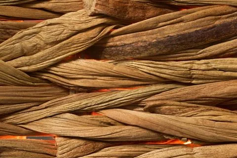 An artistic shot highlighting the precision of handmade weaving. The glowin.. Stock Photos