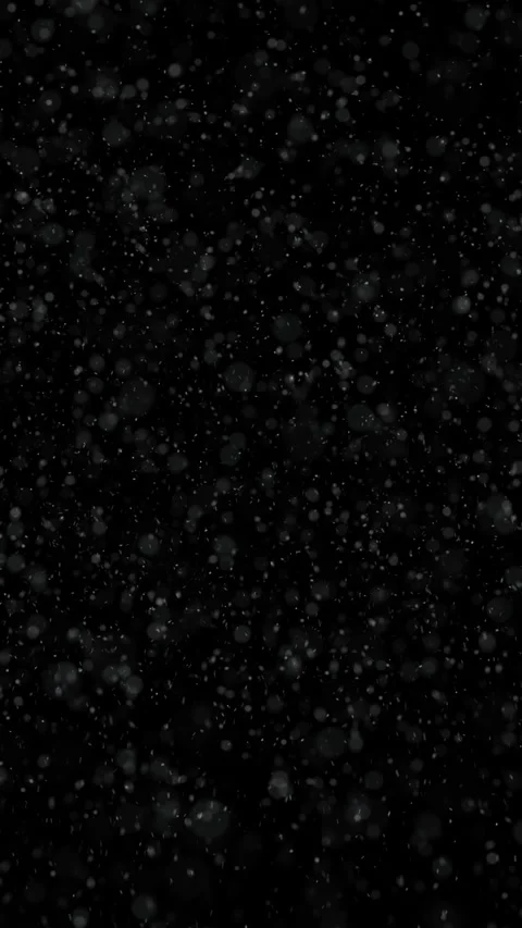 Artistic snowfall snowflakes loop falling on clean black vertical background Stock Footage 344790190