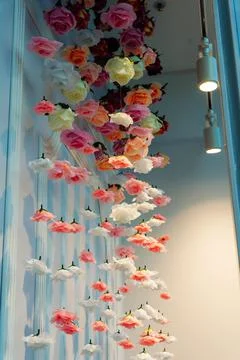 An artistic spatial composition of rose flowers suspended in the air Foto stock