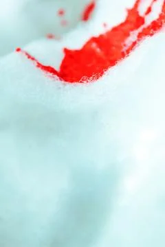 Artistic texture of red paint falling in foam, puddle and blood falling in foam Stock Photos