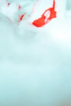 Artistic texture of red paint falling in foam, puddle and blood falling in foam Stock Photos
