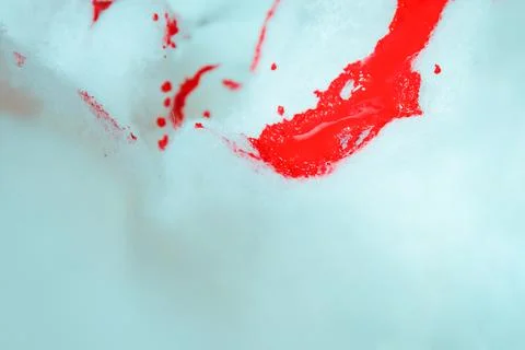 Artistic texture of red paint falling in foam, puddle and blood falling in foam Foto stock