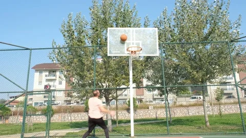 Artistic throwing basketball Stock Footage 169393460