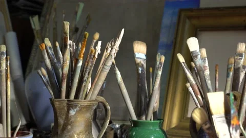 Artist's art tools in the art studio. Oil painting in creative workroom. Brushes Stock Footage 150084918