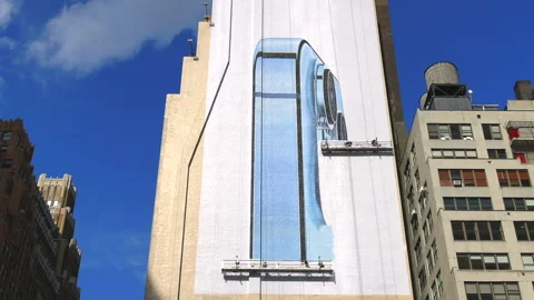 Artists create the huge mural on the building wall NYC Stock Footage 162846480