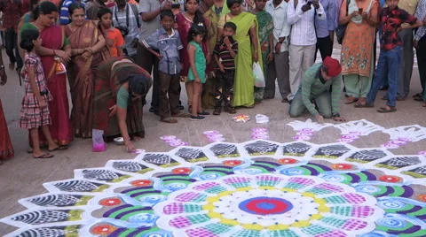 Artists create pattern of the rangoli on the pavement Stock Footage 68961211