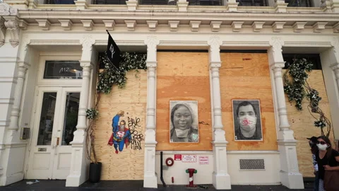 Artists create Portrait of essential workers on the Barricade Boarded in SOHO Stockbeeldmateriaal 132732194