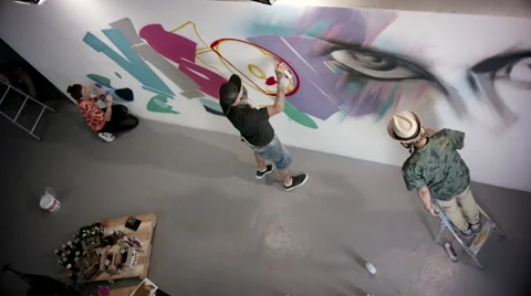 Artists doing graffiti on wall. Stock Footage 63431616