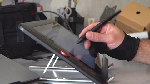 An artist's hand and a drawing tablet 4K Stock Footage 325988468