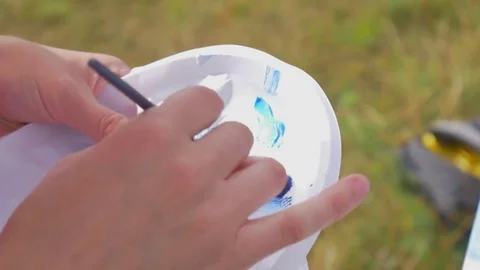 Artist's hand with a brush Stock Footage 81014562