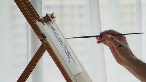 Artist's hand with a brush Stock Footage 127666222