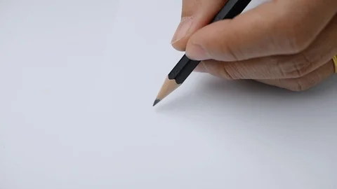 Artists hands drawing a flat line with a black pencil on paper. Stock Footage 121712356