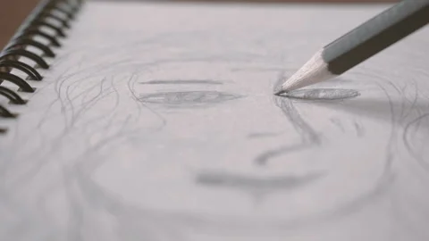 Artists hands drawing wooden pencil on paper. Close up portrait Stock Footage