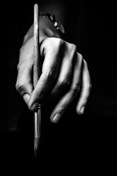 The artist's hands hold a brush Stock Photos