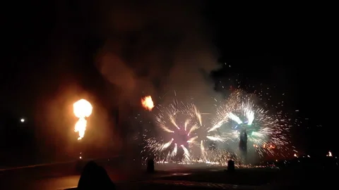 Artists jugglers dancing with fire. Fire show in the evening Stock Footage 251479983
