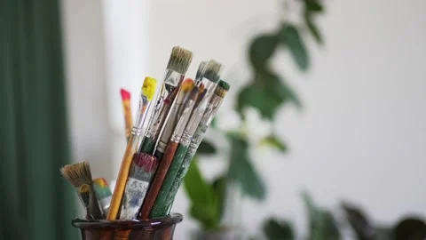 The artist's old brushes close-up. Creative profession. Inside the drawing class Stockbeeldmateriaal 156496580
