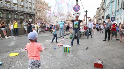 Artists organize an attraction with soap bubbles in St. Petersburg Stock Footage 67565173