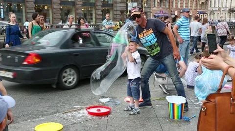 Artists organize an attraction with soap bubbles in St. Petersburg Stock Footage 67565179