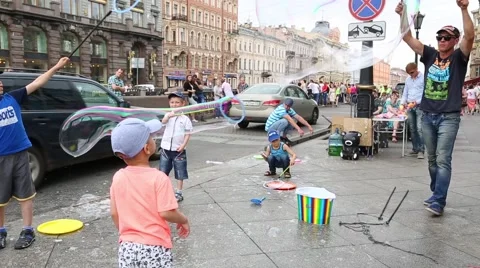 Artists organize an attraction with soap bubbles in St. Petersburg Stock Footage 67565389