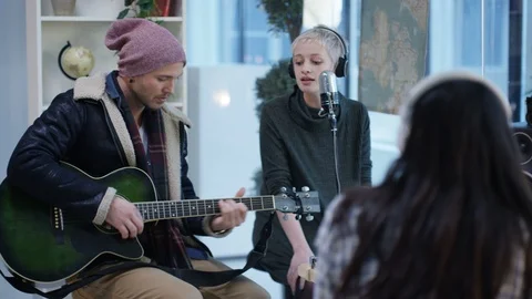 Artists performing in recording studio Stock Footage 106697863