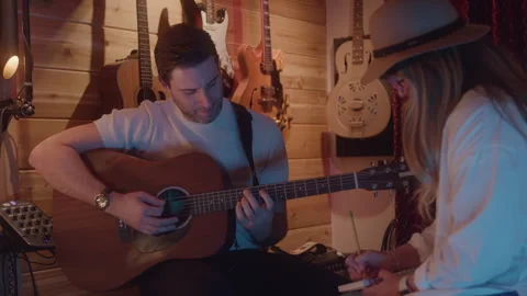 Artists In Studio Work On Song Writing Together Stock Footage 270311100