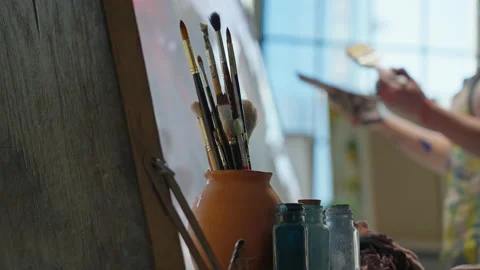 The artist's tools are brushes, paints, palette, canvas, easel, oil painting in Stock Footage 201930612