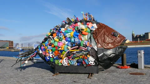 Artpiece made from scrap - a fish next to the harbor Stockbeeldmateriaal 60265986