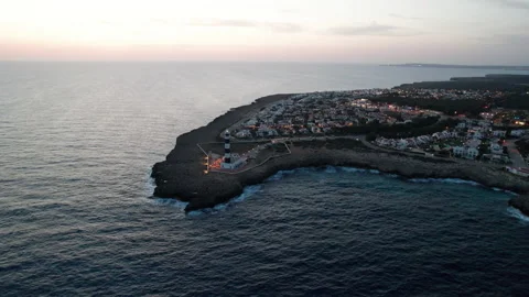 Artrutx lighthouse stunning sunset light drone aerial rocky clifftop in Menorca Stock Footage 238992575