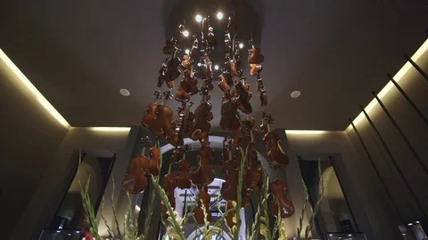An artwork of hanging violins Stock Footage 82076814