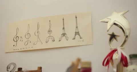 Artwork of trebleclef to Eiffel Tower with star shaped trophy in front Video stock 144610487