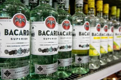 Aruba, 12/2/2019: Bottles of Bacardi rum stand on a shelf in a liquor store. Stock Photos